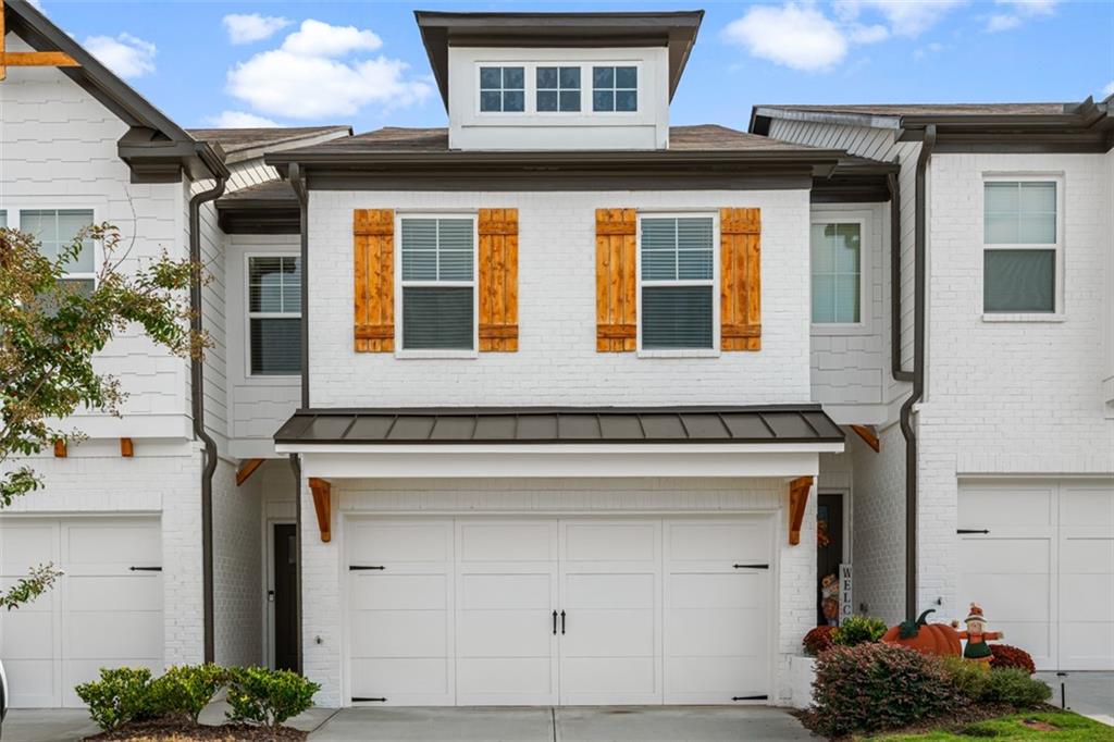 a front view of a house with a garage