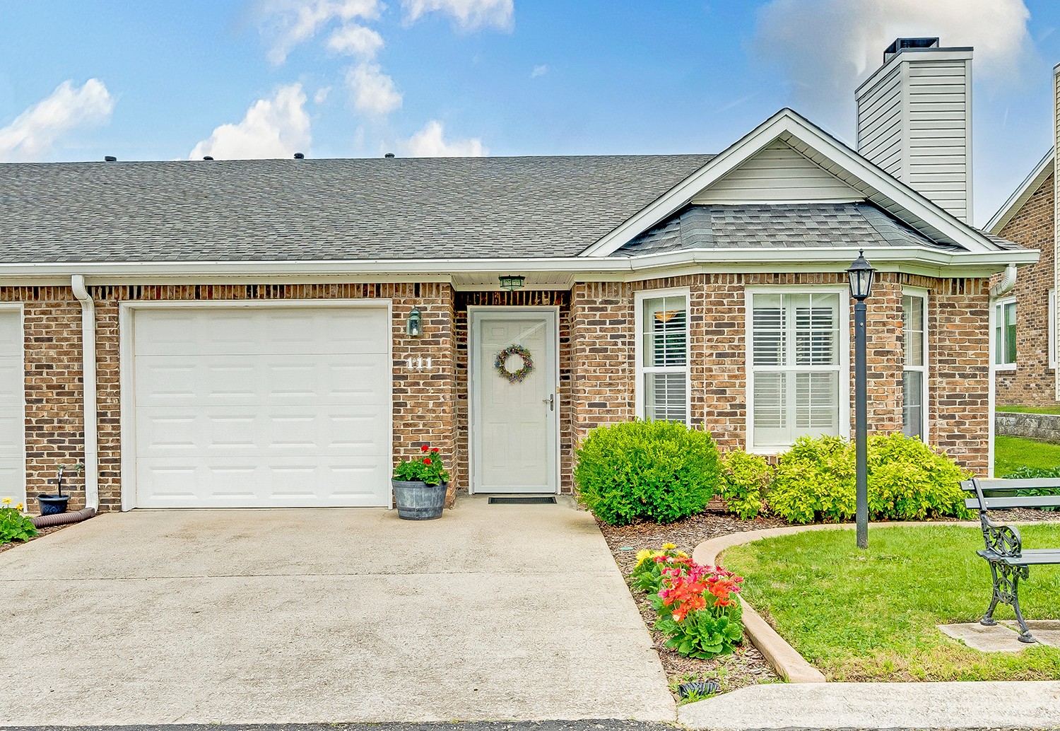 a front view of a house with garden