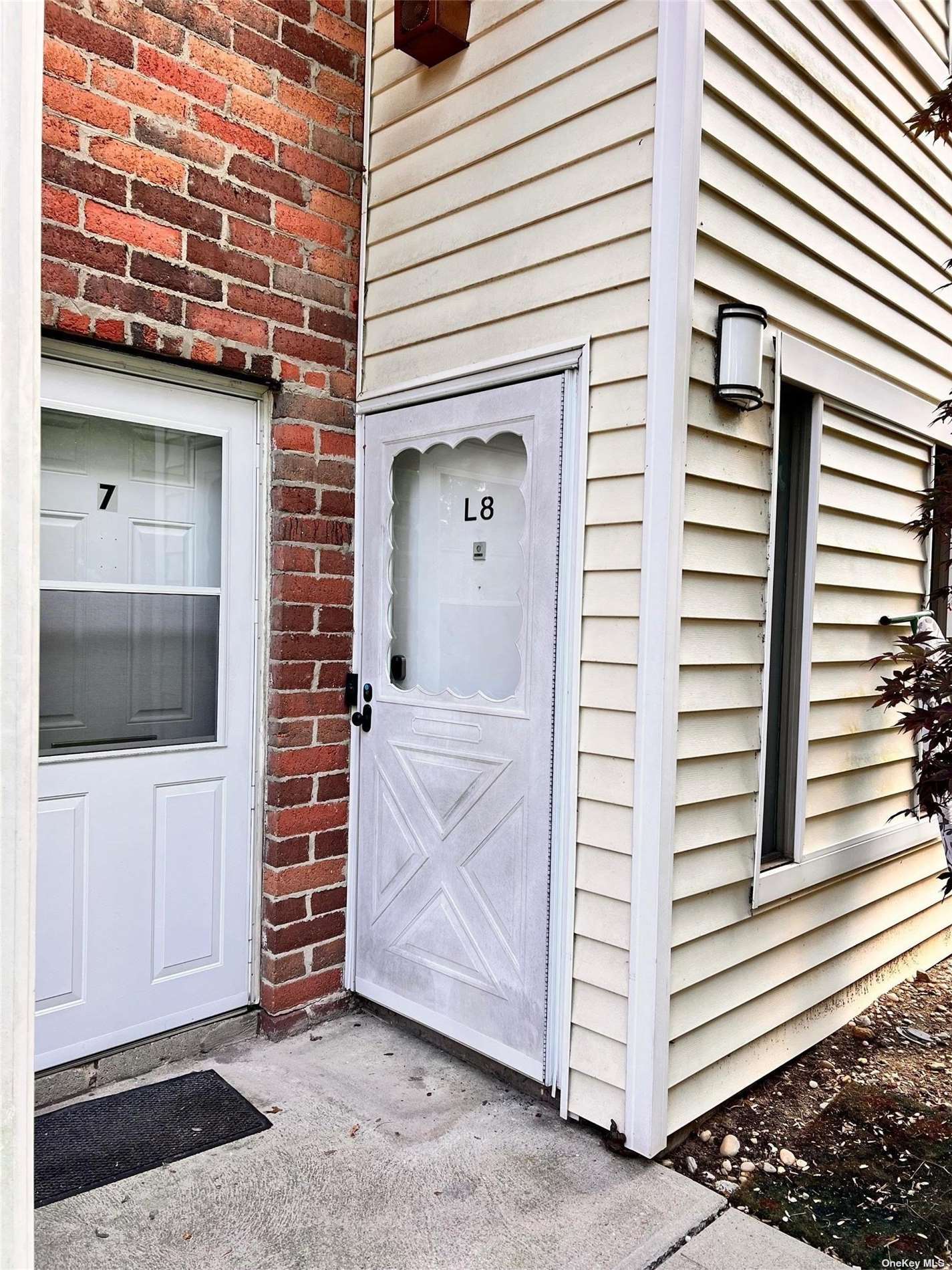 a view of a door and a window