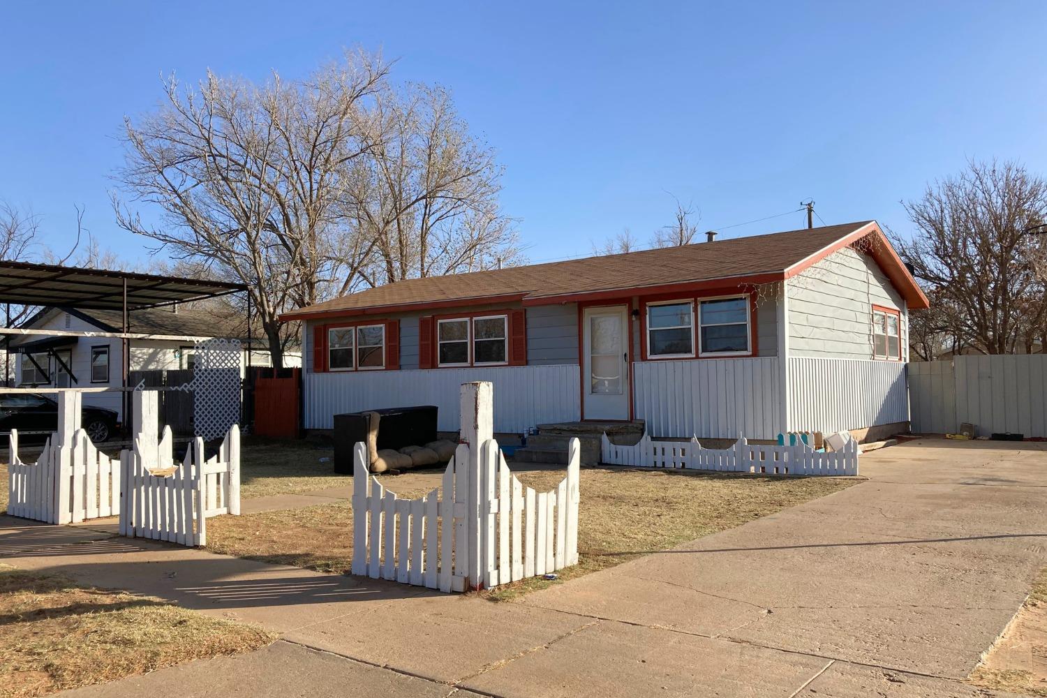 a front view of a house with a outdoor space