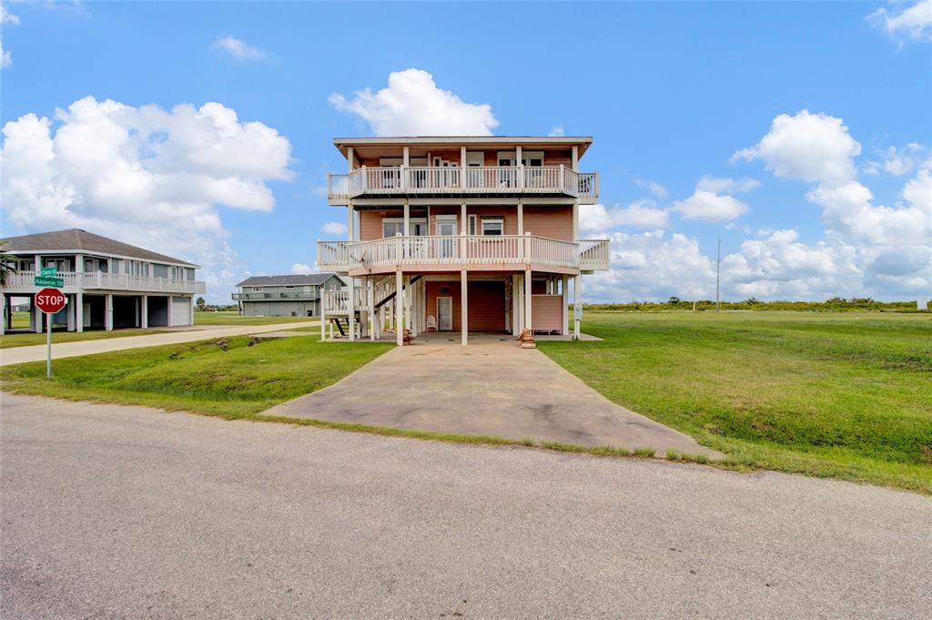 a view of building with yard in front of it