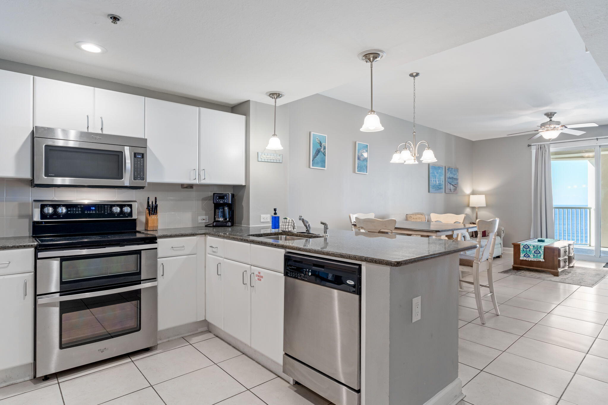 a kitchen with a sink stove and microwave