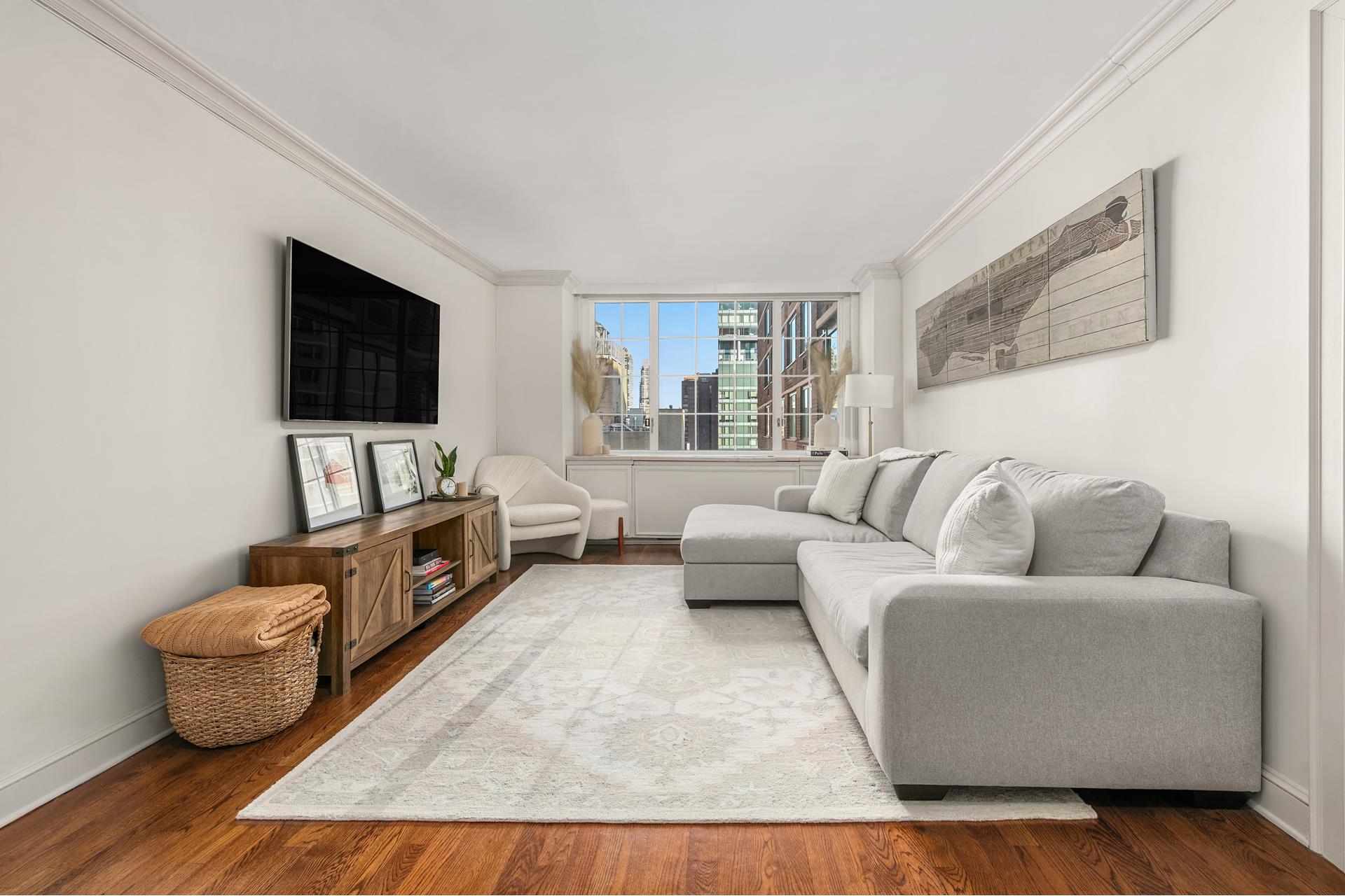 a living room with furniture and a flat screen tv