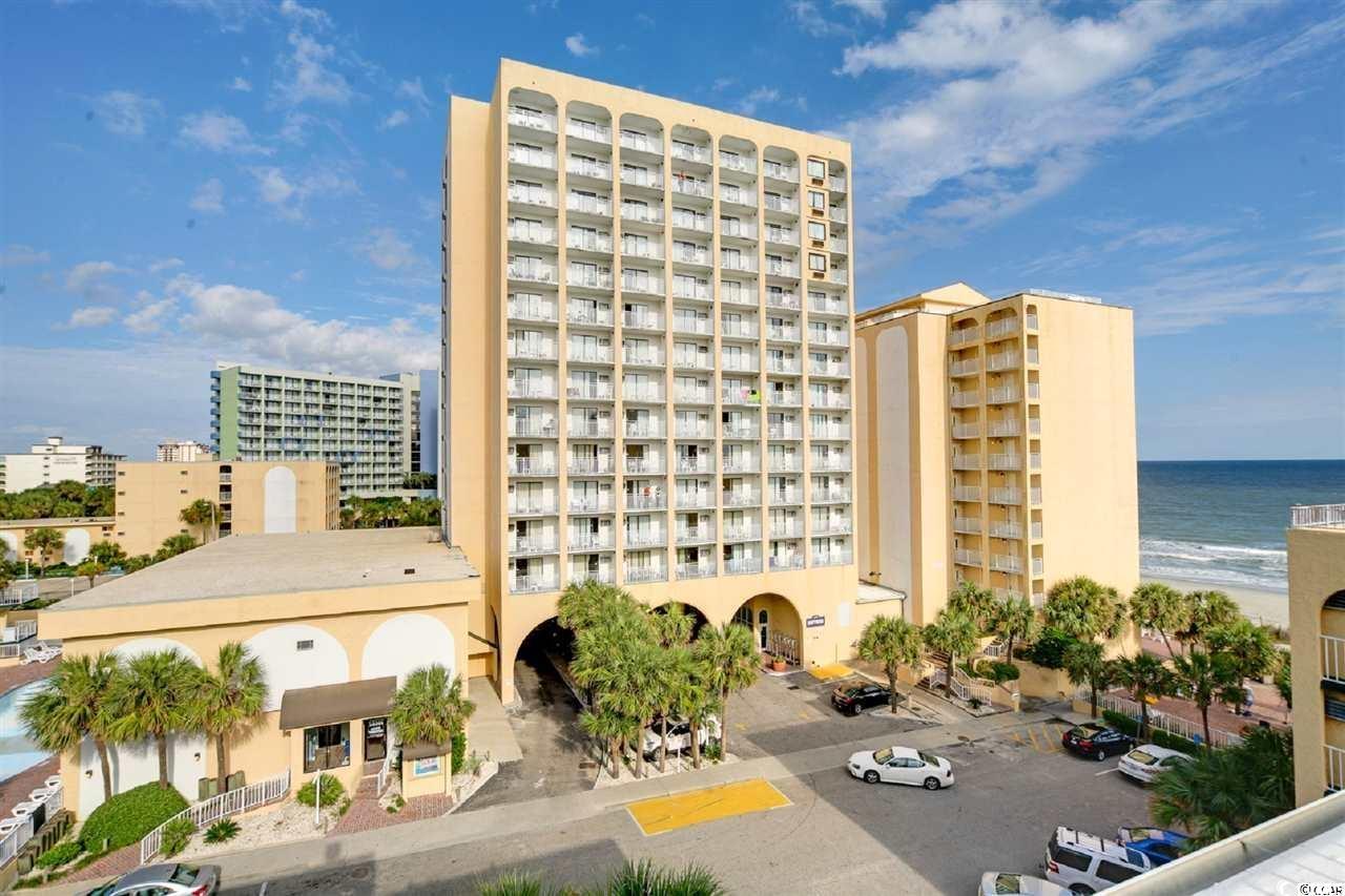 View of building exterior featuring a water view