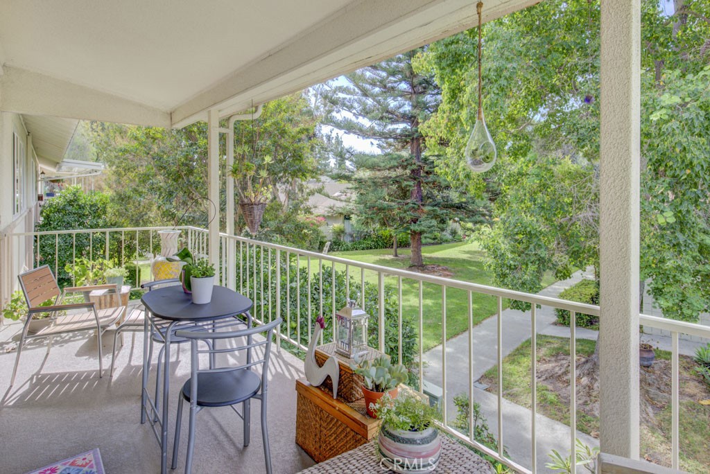 a view of a chair and table in the patio