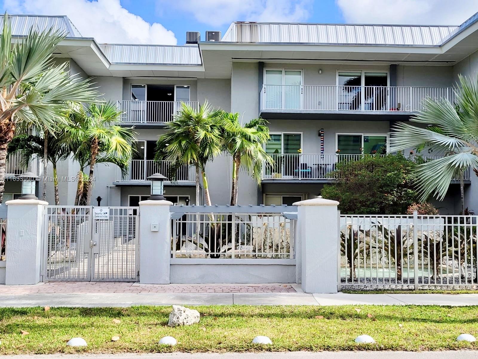 a view of house with outdoor space and swimming pool