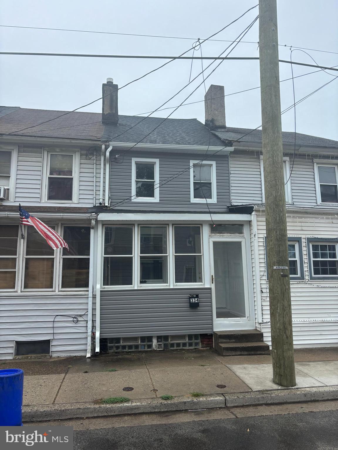 a front view of a house with a empty space