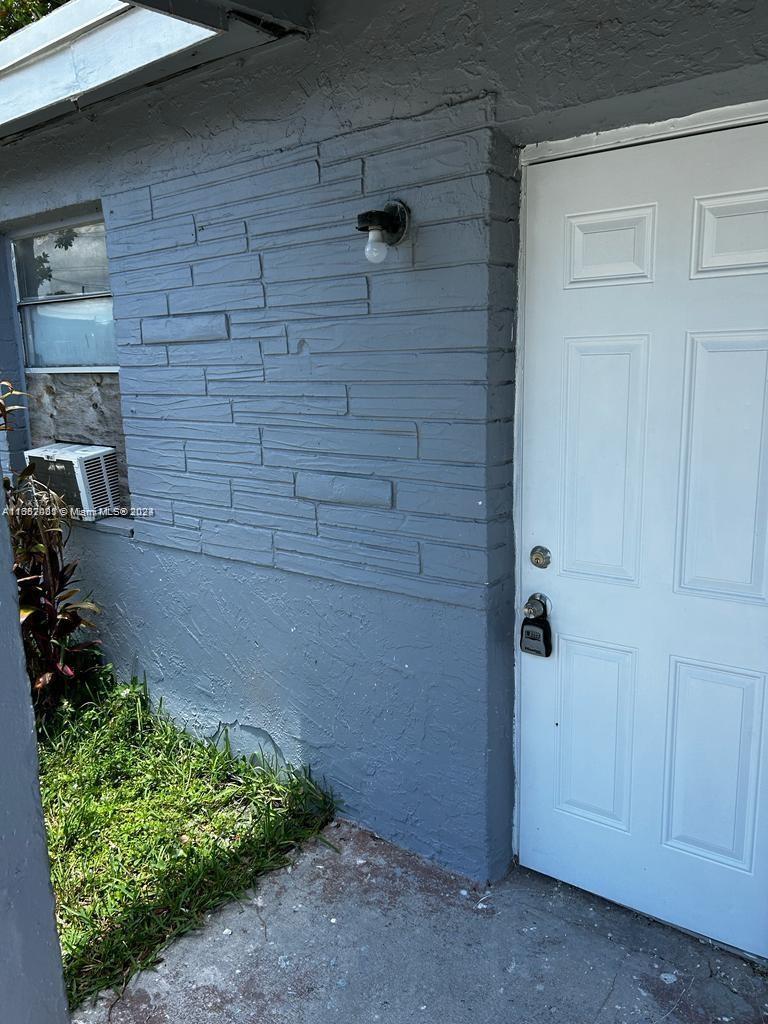 a view of a door and an empty room