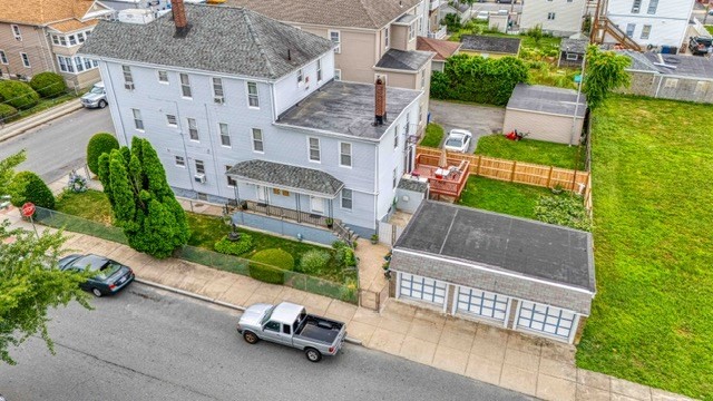 an aerial view of a house with outdoor space