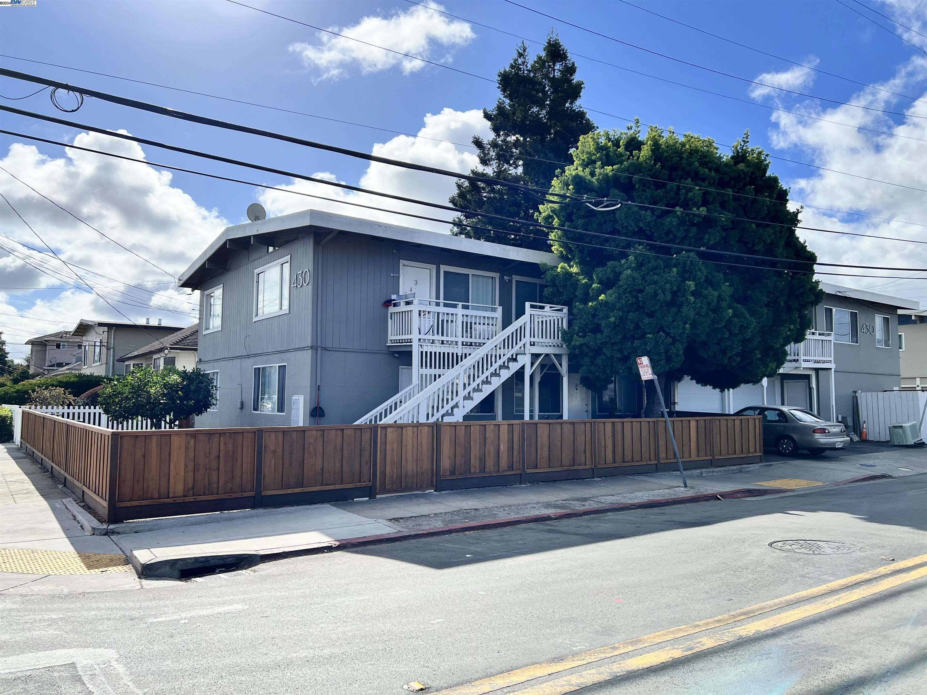 a view of a house with a fence