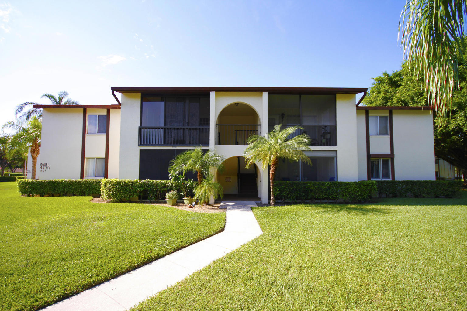 a front view of house with yard and outdoor seating