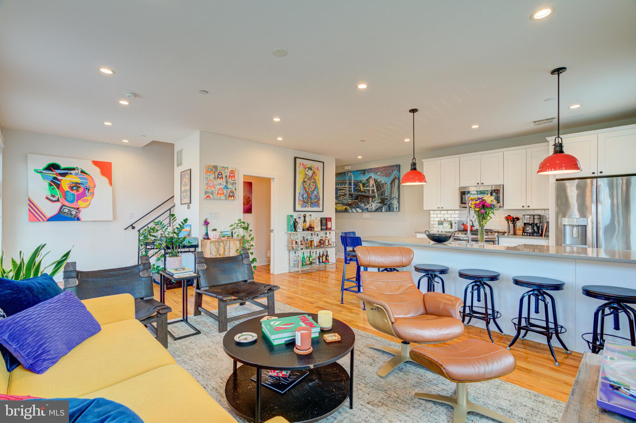 a living room with furniture kitchen and kitchen view