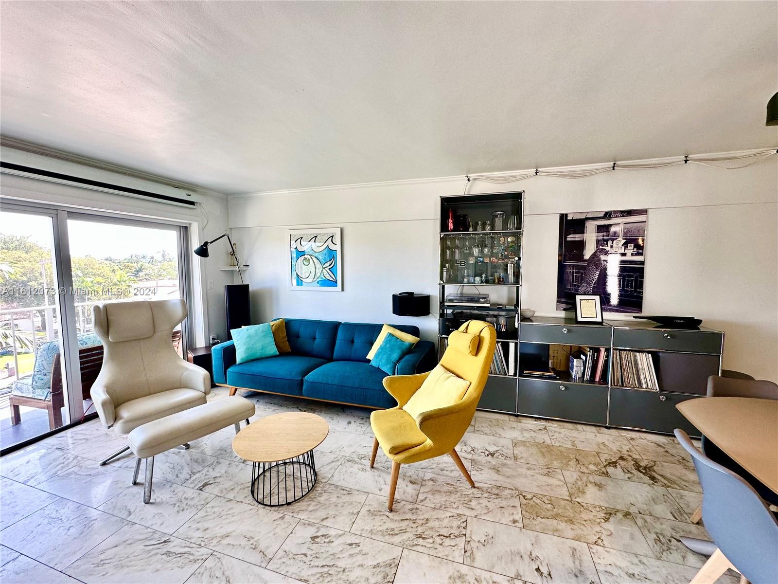 a living room with furniture and a table