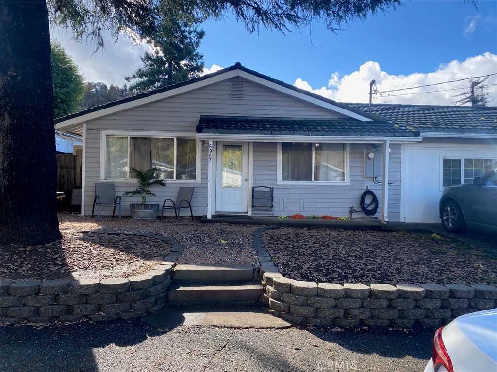 a front view of a house with yard