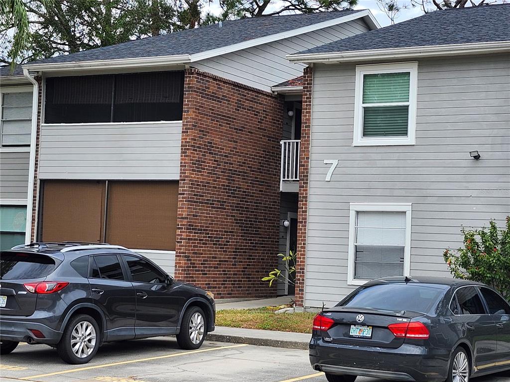 a view of a car parked in front of a house