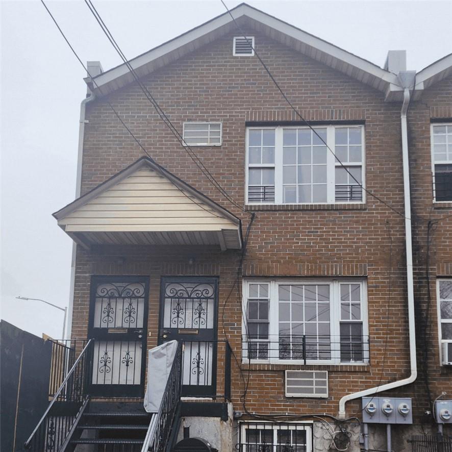 a front view of a house with glass windows