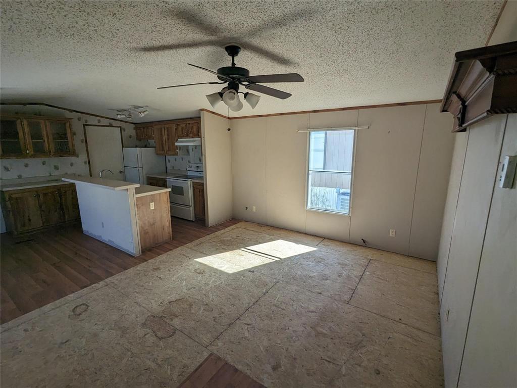 a view of a kitchen with a sink and dishwasher