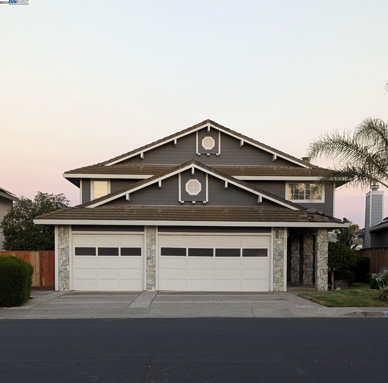 a front view of a house with a garage