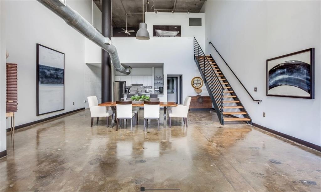 a dining room with furniture and entryway