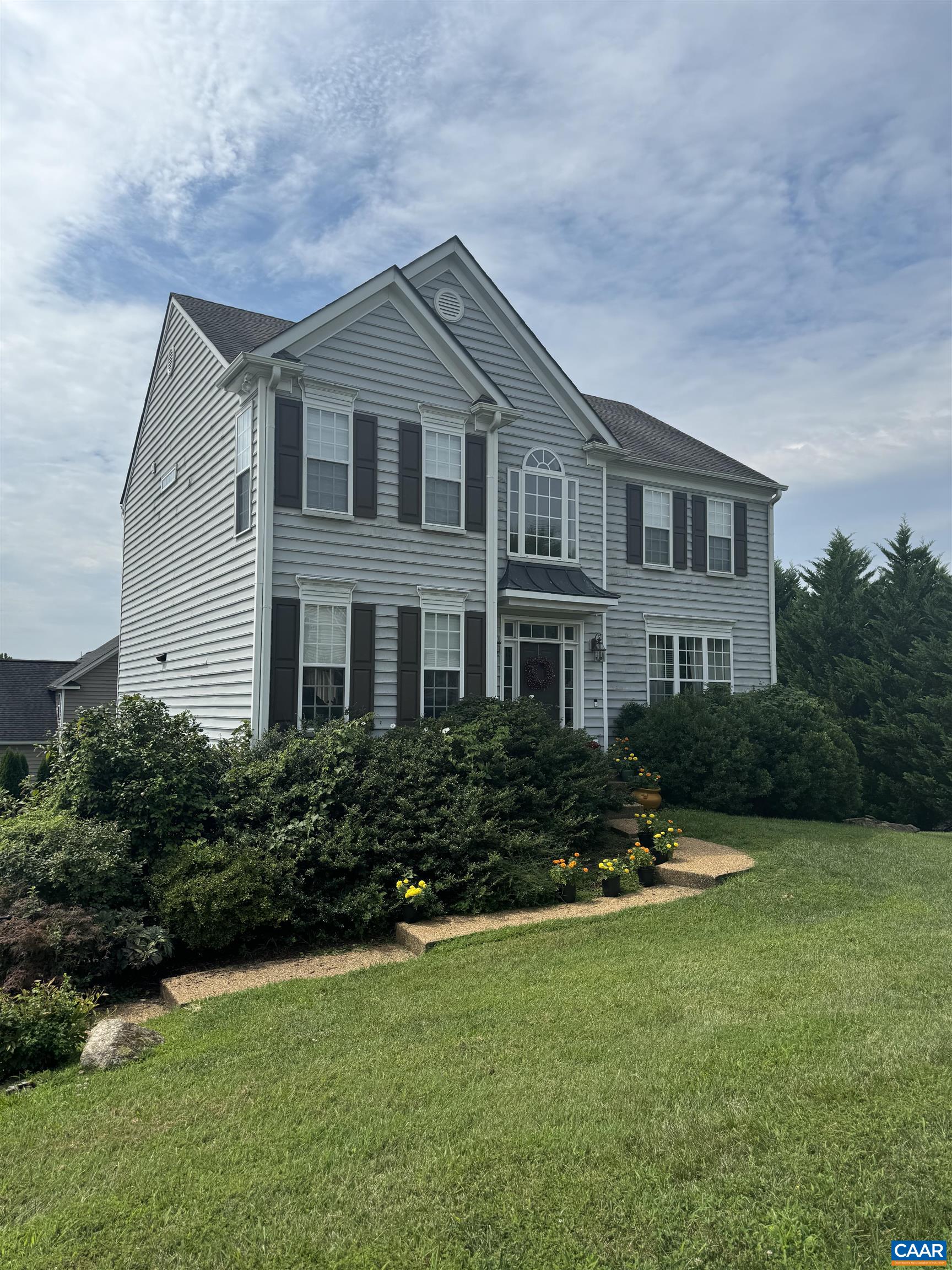 a front view of a house with a yard