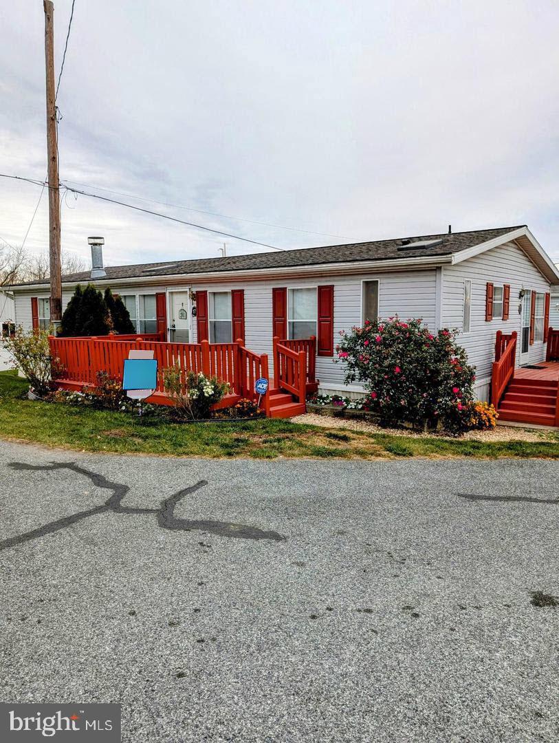 front view of a house with a big yard