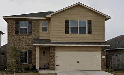 a front view of a house with garage