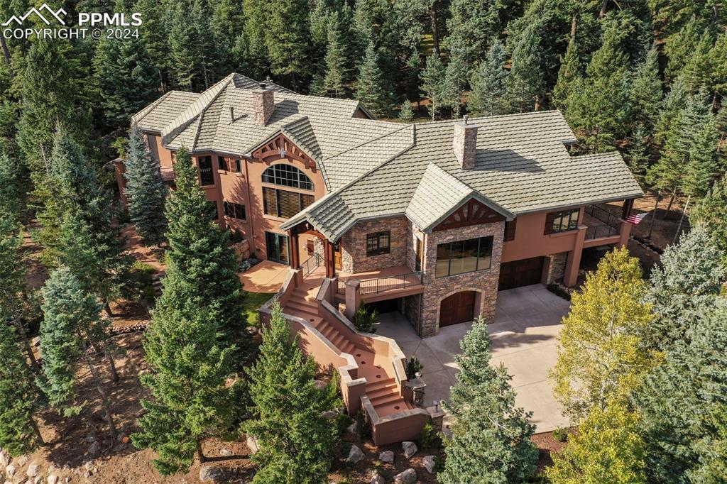 an aerial view of a house with a yard