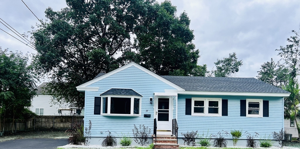 a front view of a house with garage