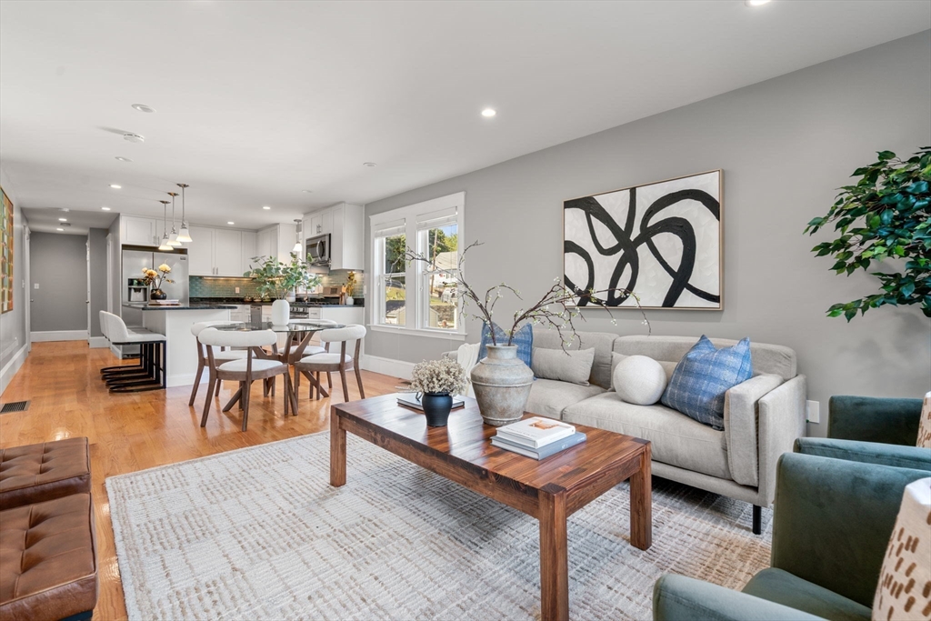 a living room with furniture and a table