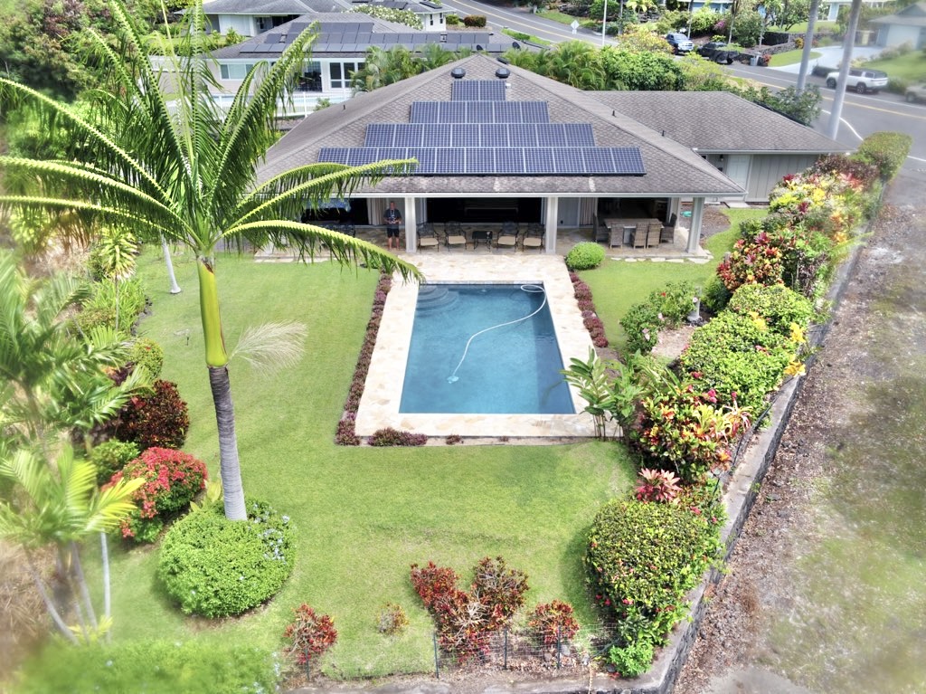 76-149 Kamehamalu Street 2112 sf 3 bedroom 3 bath home built in 2000 at the end of a caldesac on 15,292 sf more or less with an alleyway pictured right and vacant land at left not seen.