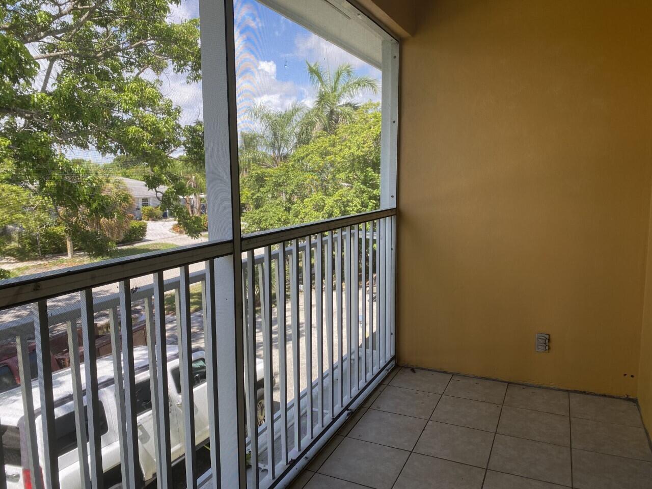 a view of a porch with a floor to ceiling window