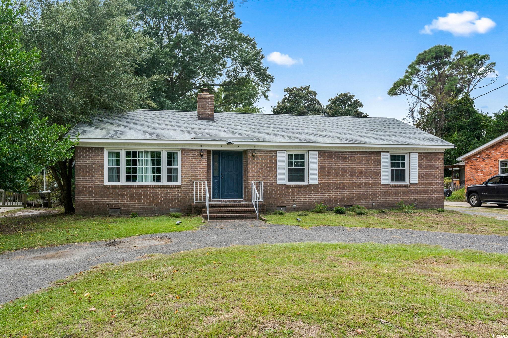 Single story home featuring a front yard