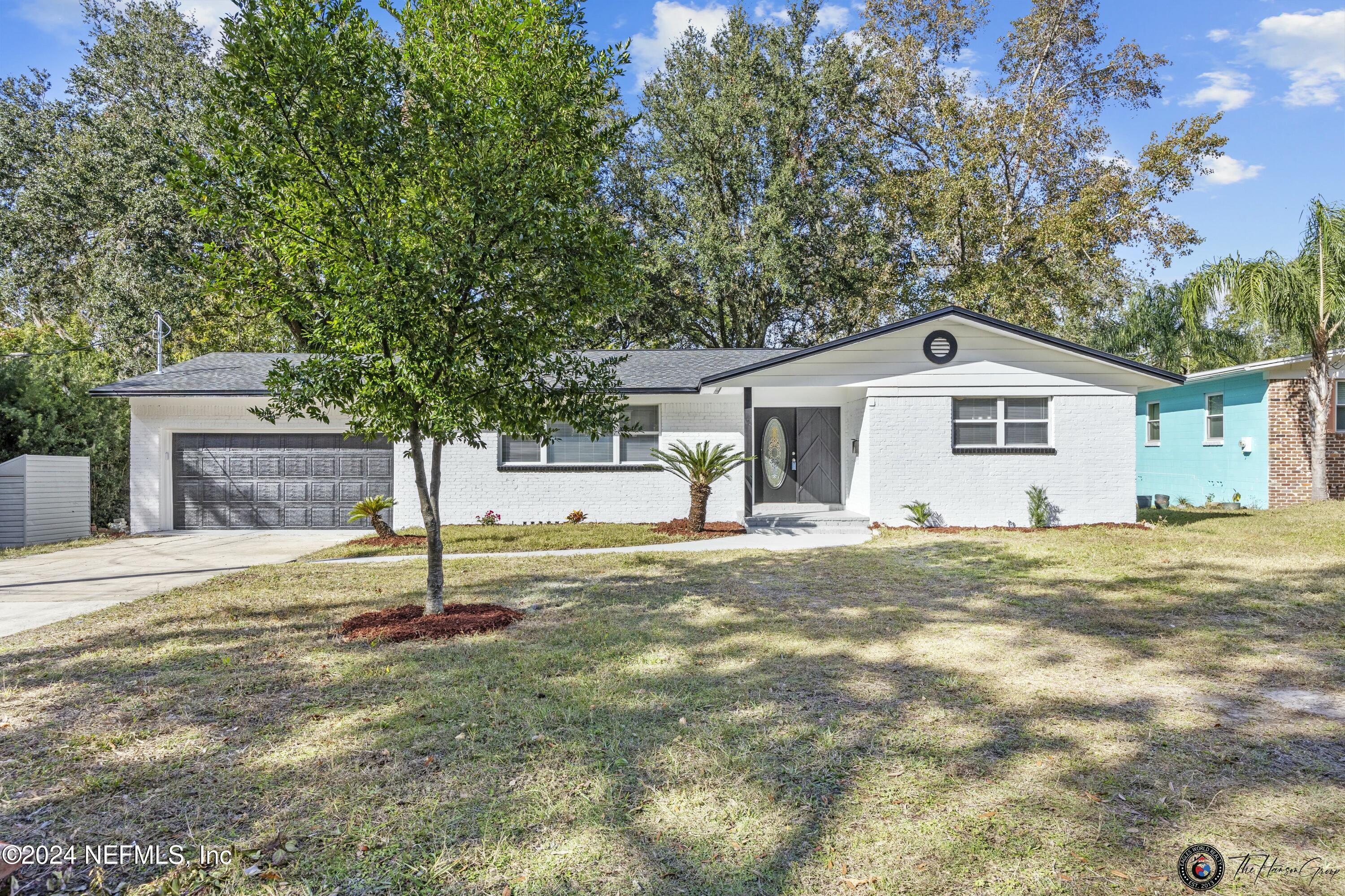 a house with trees in the background