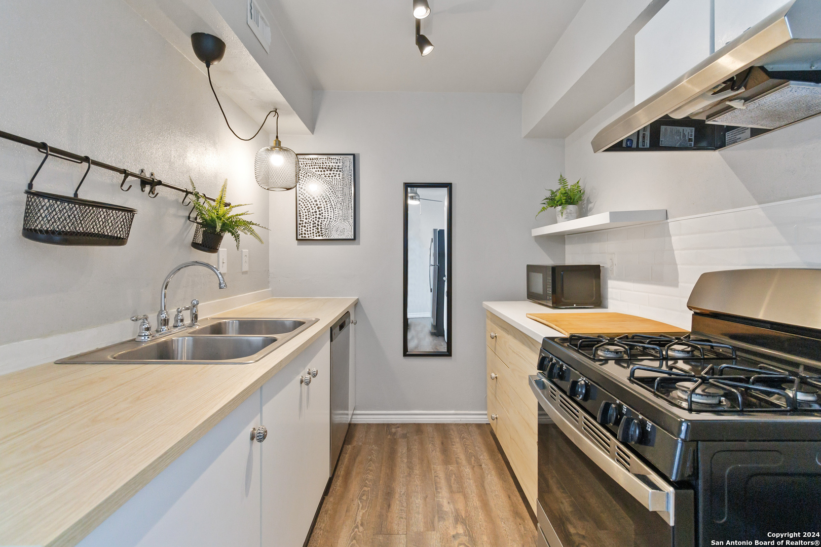 a kitchen with a stove and a sink