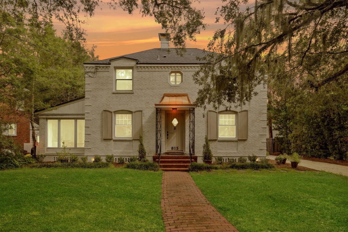 a front view of a house with garden