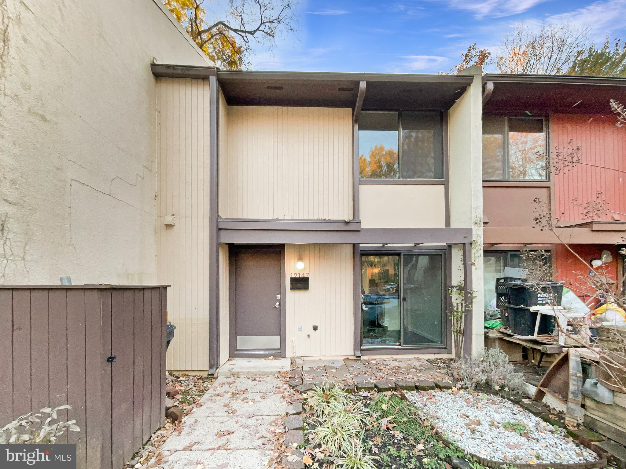 a front view of a house with parking space