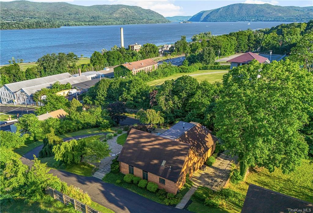 an aerial view of a house with yard