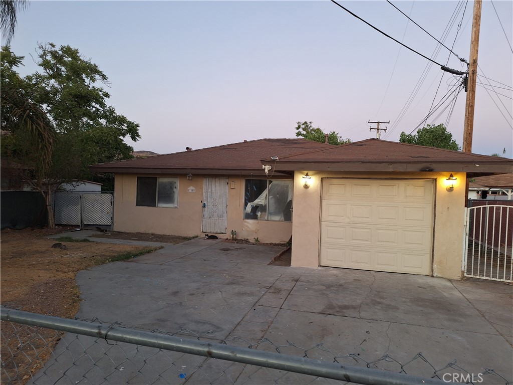 a front view of a house with a garage