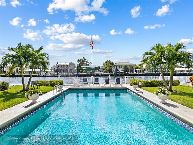 a view of swimming pool with outdoor seating and yard