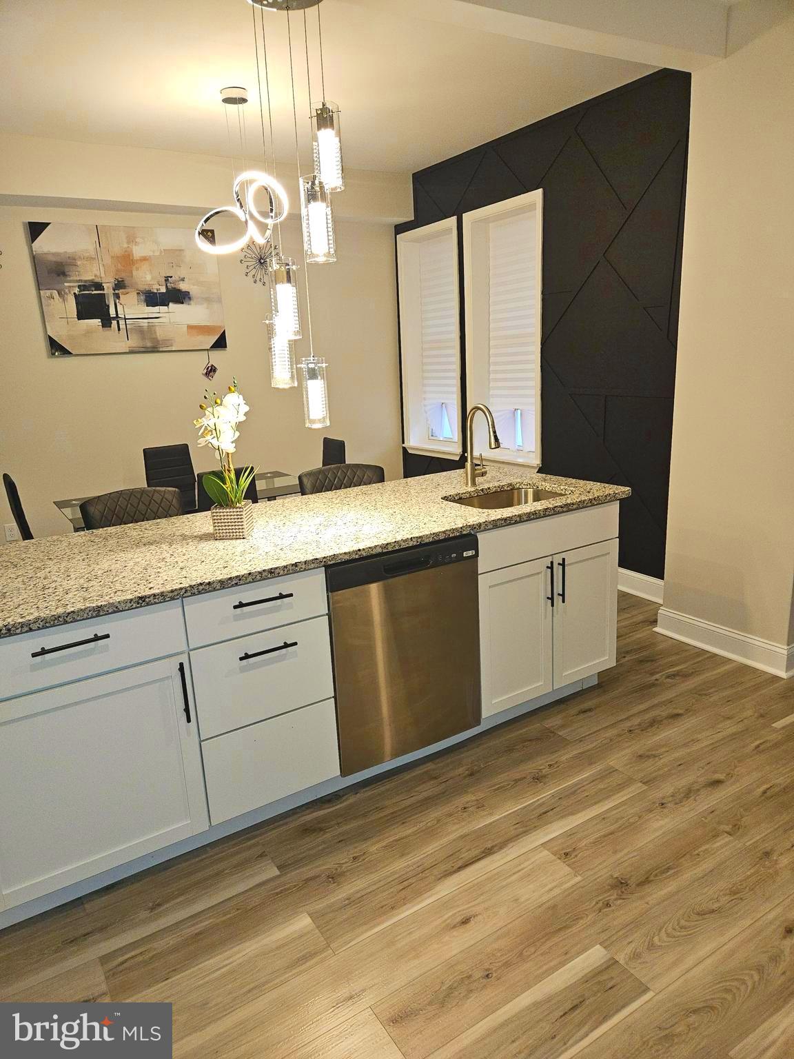 a view of a kitchen with a stove and a sink