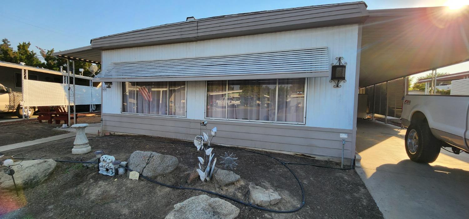 a front view of a house with barbeque area