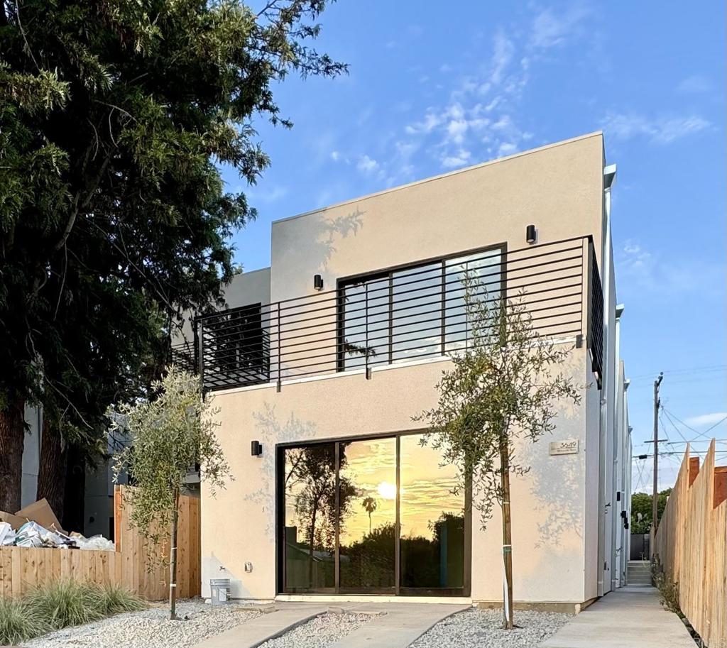 a view of a house with a tree