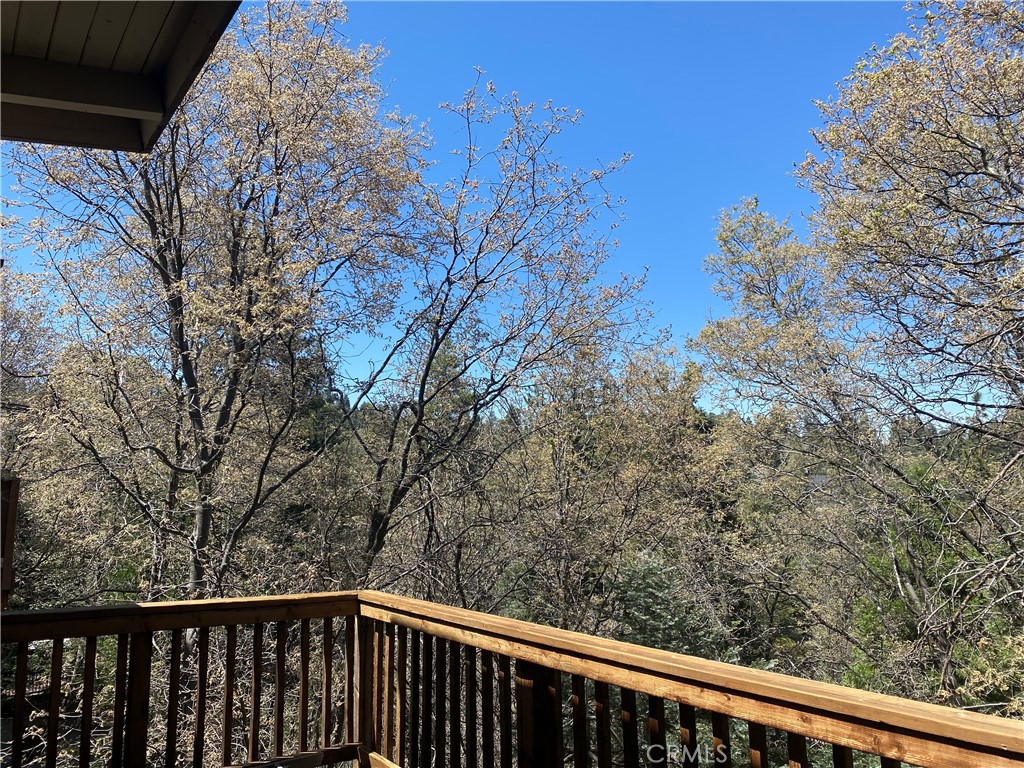 a balcony with trees in front of it