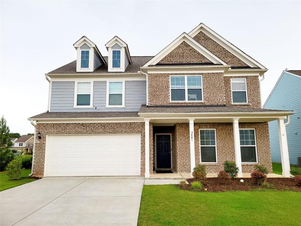 a front view of a house with yard