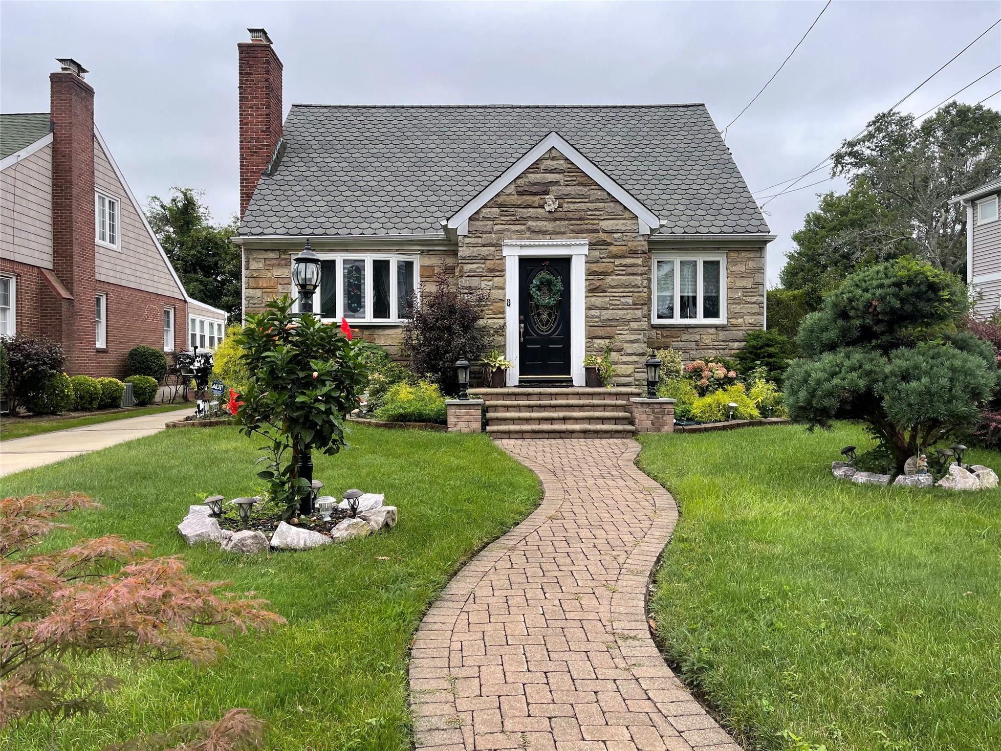 View of front of house with a front yard