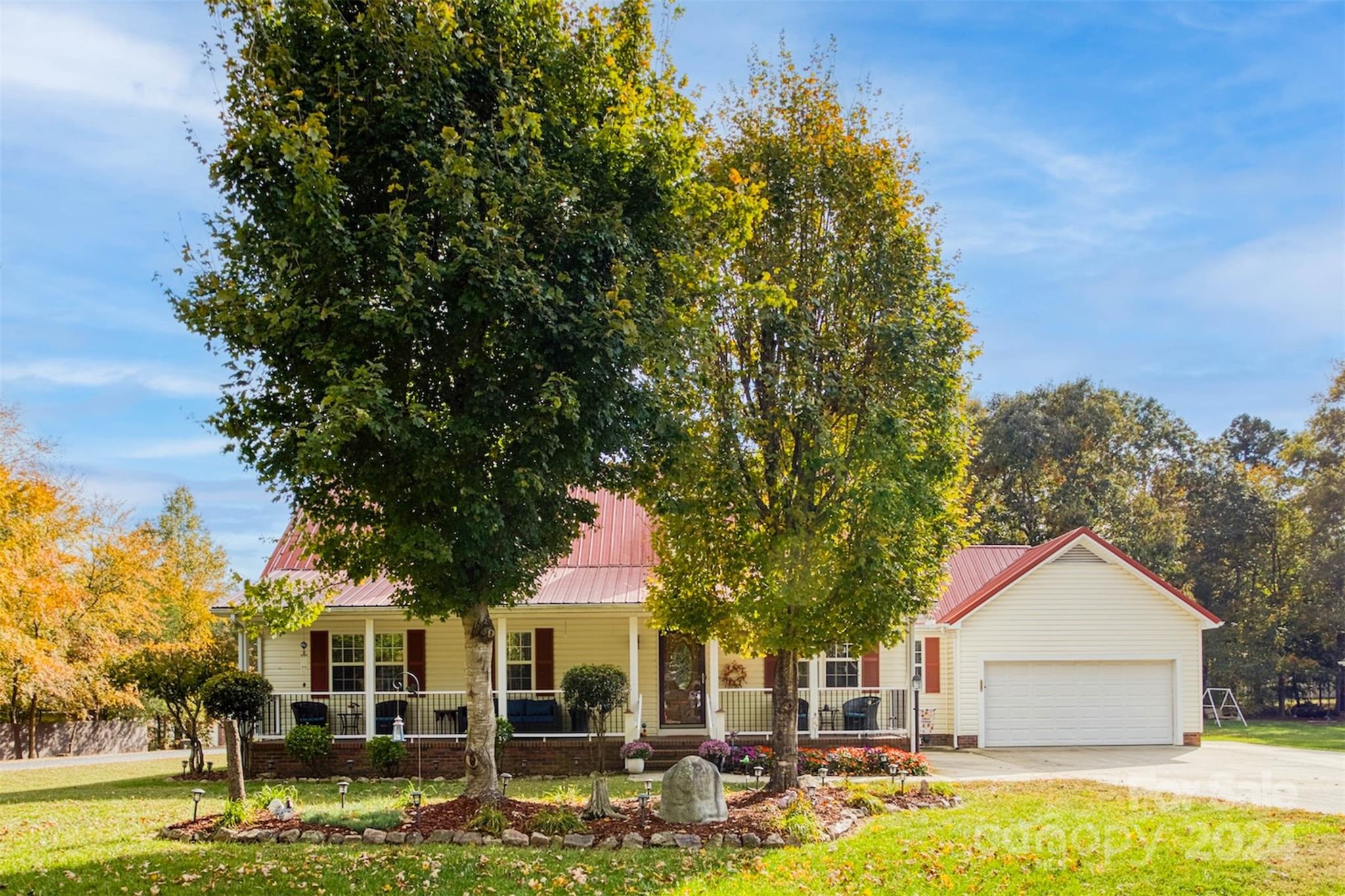 a front view of a house with garden