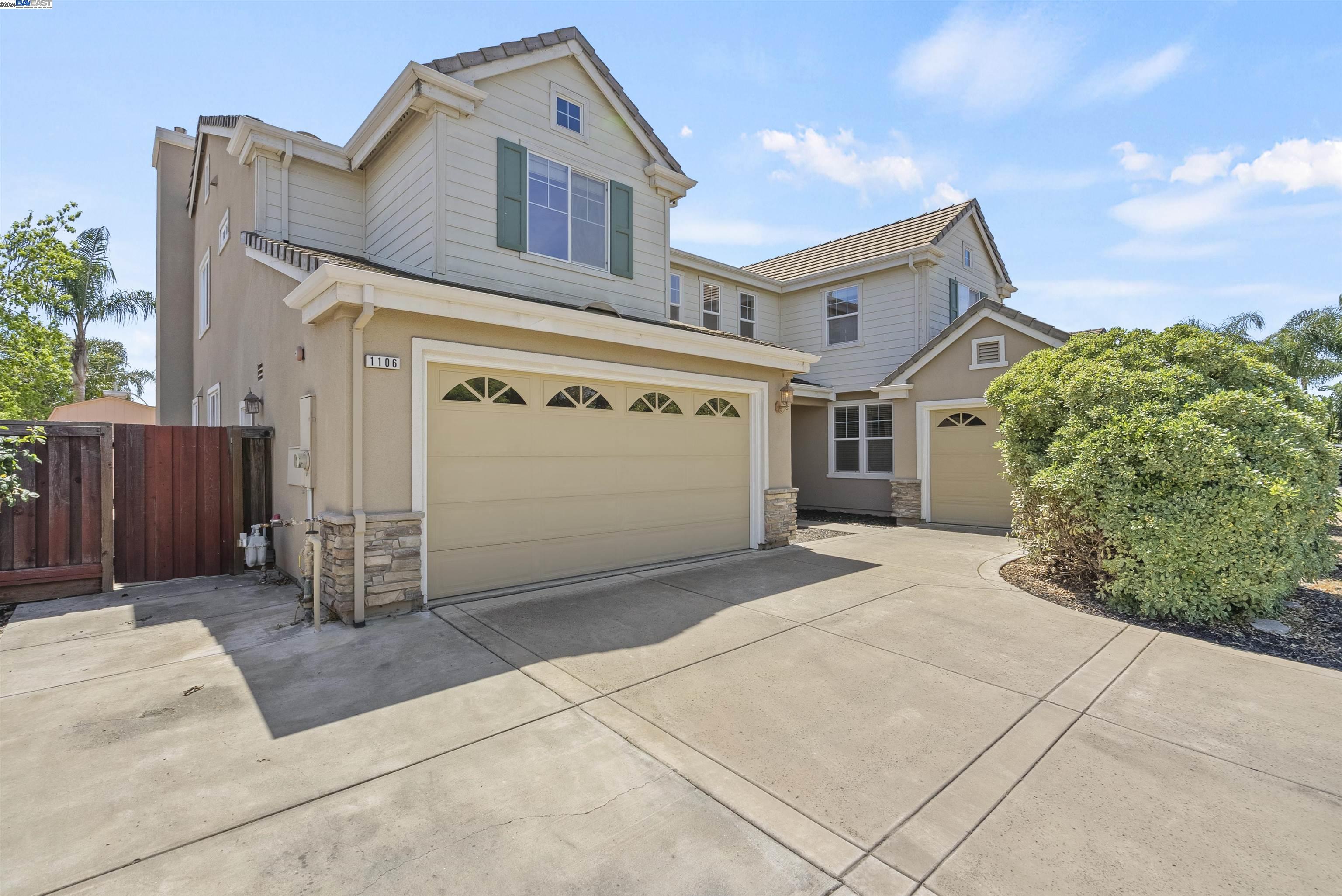 a front view of a house with a garage