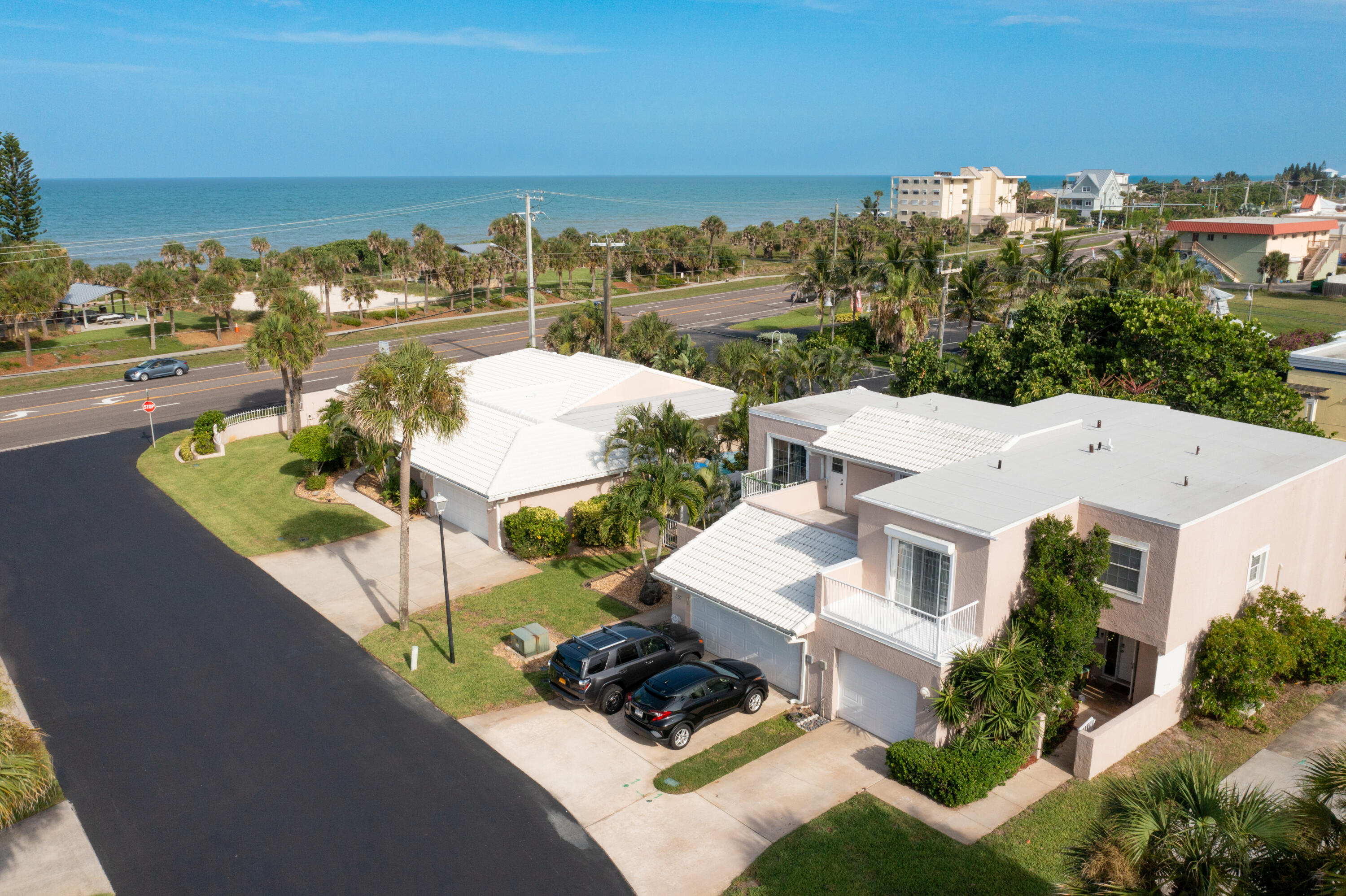 an aerial view of residential houses with outdoor space