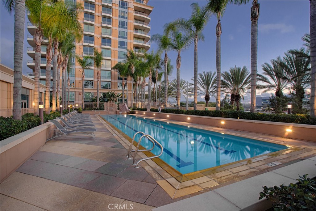 a view of swimming pool with outdoor seating