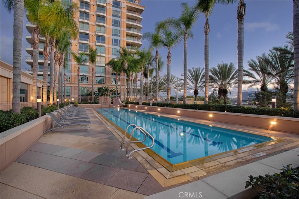 a view of swimming pool with outdoor seating